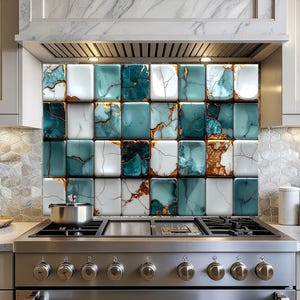 May include: A kitchen backsplash featuring a grid of square tiles. The tiles alternate between white, teal, and teal with gold veining. The backsplash is installed above a stainless steel range with a pot on the stovetop.