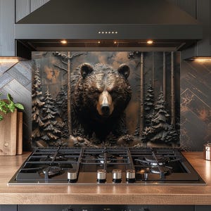 May include: A kitchen backsplash featuring a detailed relief of a bear in a forest setting. The bear is brown with a focused expression, surrounded by stylized trees. The backsplash is mounted above a black gas stovetop and a wooden countertop.