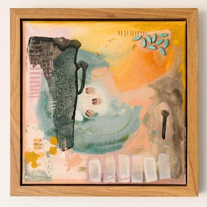 May include: A square abstract painting in a light wood frame featuring a large, textured dark green vertical shape on the left. The background consists of blended yellow, peach, and teal washes with small turquoise leaf-like accents and white rectangular marks.