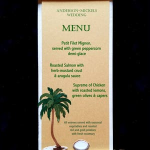 May include: A wedding menu scroll with a gold trim and a palm tree illustration. The menu includes Petit Filet Mignon, Roasted Salmon with herb-mustard crust, and Supreme of Chicken with roasted lemons, green olives & capers. All entrees are served with seasonal vegetables and roasted red and gold potatoes with fresh rosemary.