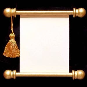 May include: A gold-colored scroll with a blank white paper. The scroll has gold finials and a gold tassel hanging from the top. The background is black.