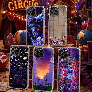 May include: Five clear smartphone cases featuring various colorful graphic designs inspired by The Digital Circus, including character illustrations, a starry sky with eyes, a sunset landscape, and a grid pattern with small cartoon figures.