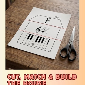 May include: A sheet of paper with a house outline, musical notes, and a piano keyboard design. The text "CUT, MATCH & BUILD THE HOUSE" is at the bottom. A pair of scissors rests on a wooden surface.