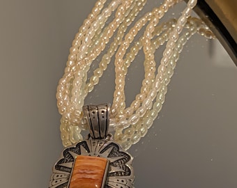 Muszla ostrygi ze srebra próby Navajo z autografem Carolyn Pollack i Tommy'ego Singera