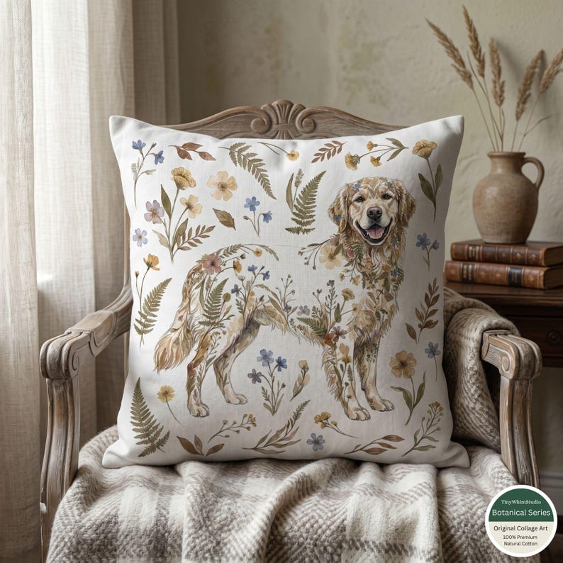May include: Square throw pillow featuring a Golden Retriever illustration adorned with floral and fern patterns in shades of brown, yellow, and blue. The pillow is set against a neutral background, creating a cozy, cottage-style aesthetic. The pillow is made of 100% natural cotton.