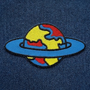 May include: A set of three ceramic mugs with a speckled, matte finish. The mugs are in shades of cream, light gray, and dark gray. Each mug has a simple, minimalist design, perfect for coffee or tea.