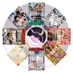 May include: A collection of trading cards featuring anime characters, including Roronoa Zoro, Monkey D. Luffy, and Nami. The cards have colorful illustrations and the word "SAMPLE" is printed on several cards. A pink Mew character is in the center.