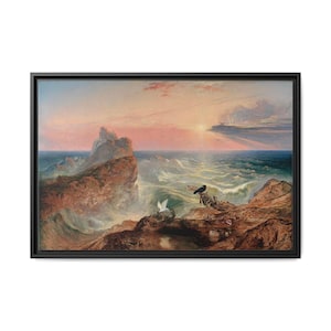 May include: A framed canvas print of a seascape painting. The artwork depicts a dramatic ocean scene with crashing waves, rocky cliffs, and a sunset sky. Two birds are perched on the rocks. The color palette includes shades of blue, brown, and pink.
