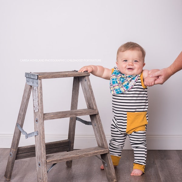 Super soft tank style pocket romper. Snap-less, soft cotton.