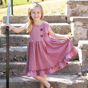 Girls tank style knit dress with ruffled bodice detail.  Custom colors and sizes.
