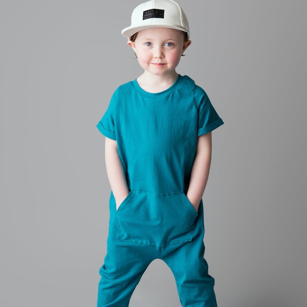 Super soft short sleeve pocket romper. Snap-less, soft cotton. Custom made 0 to 4t in many different colors.