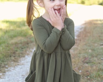 Girls long sleeve pocket knit dress.  Custom order in many colors.   Available girls 12 months  to 12 years.