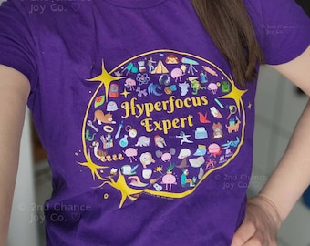 Hyperfocus Expert - Coupe femme/junior - Mini-icônes TDAH, amour de soi et neurodiversité T-shirt ajusté