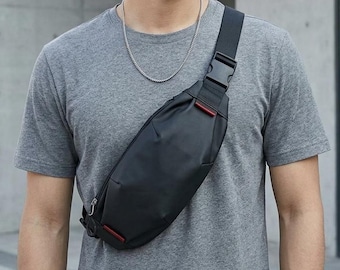 Bolso bandolera para hombre de tela Oxford – Bolso bandolera multifuncional, bolsillo ligero para el teléfono, ideal para viajes, senderismo, ciclismo y uso diario.