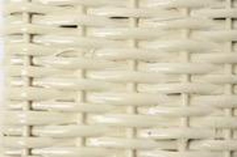 May include: Close-up of a section of woven wicker. The wicker is a light cream color, with a repeating pattern of horizontal and vertical lines. The weave is tight and even, creating a textured surface.