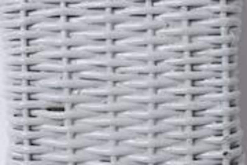 May include: Close-up of a white woven wicker pattern. The texture shows a tight, repeating grid of interwoven strands, creating a solid, durable surface. The color is a bright, clean white, suggesting a fresh, modern aesthetic. The weave is consistent and even throughout the image.