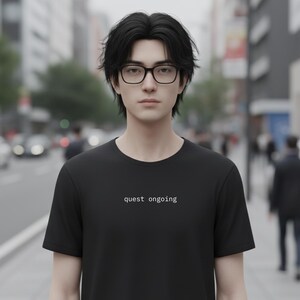 „Quest Ongoing“ – Minimales Rollen-T-Shirt | 06session