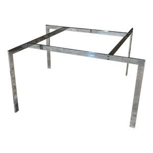 May include: A chrome metal table base with a square top and a simple, modern design.