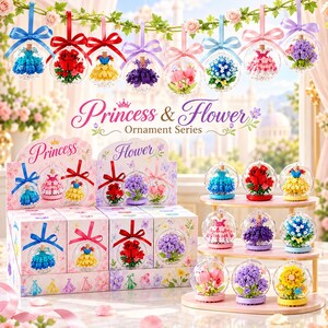 May include: A collection of Princess & Flower Ornament Series building block sets featuring miniature dresses and floral arrangements encased in clear spherical ornaments with colourful ribbons, displayed in decorative boxes and on a tiered stand.