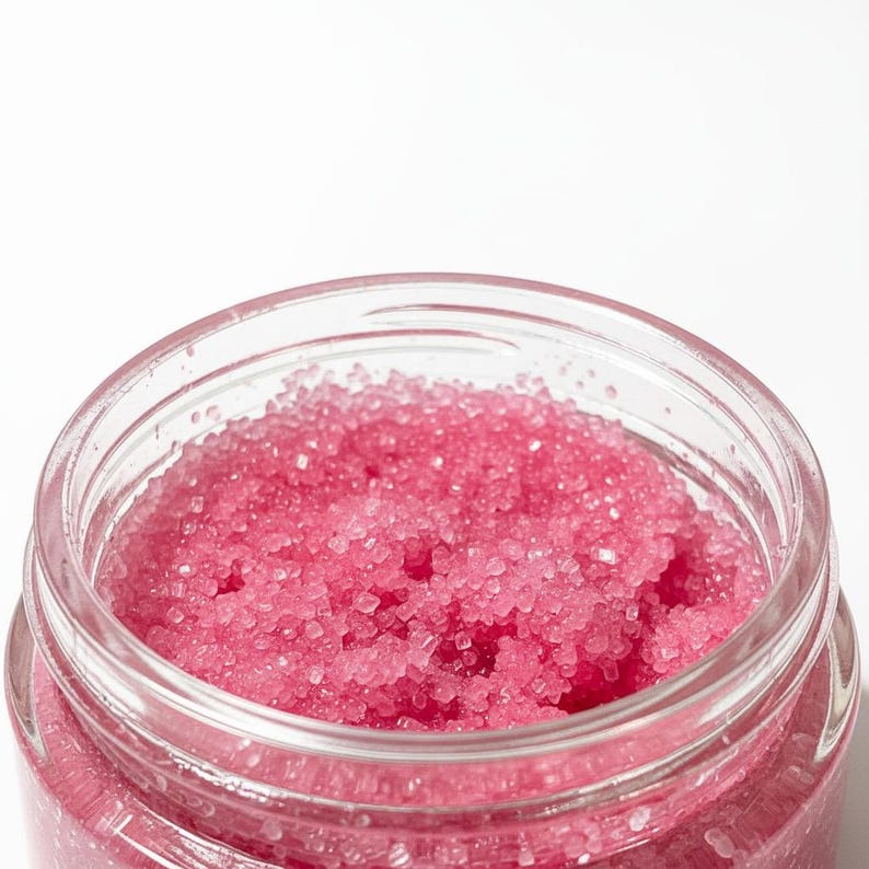 May include: A set of three ceramic canisters with lids. The canisters are white with a blue floral pattern. The largest canister is 8 inches tall, the medium is 7 inches, and the smallest is 6 inches.