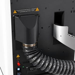 May include: The back panel of a white machine features a black exhaust vent connected to a flexible, corrugated black hose with a metal clamp. A power cable is plugged into a port below a red switch, with yellow warning labels visible.