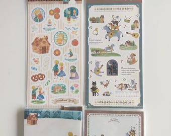 Puede incluir: Dos hojas de pegatinas verticales y dos blocs de notas rectangulares con ilustraciones de Hansel y Gretel y los Músicos de Bremen. Los diseños incluyen personajes coloridos, casas de jengibre, animales y textos en alemán.