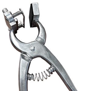 May include: A silver metal ear tag applicator. The tool features a spring, a pivoting handle, and a clamping mechanism. It is designed for applying ear tags to livestock. The tool is shown against a white background.