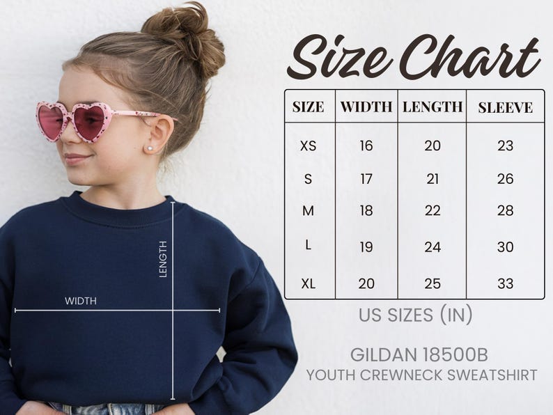 A young girl wearing a navy blue crew neck sweatshirt and pink heart-shaped sunglasses, with a size chart and US sizes (IN) for the sweatshirt.