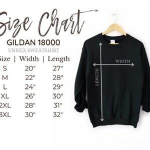 a black sweatshirt with size charts and measurements for different sizes, including S, M, L, XL, 2XL, and XXL.