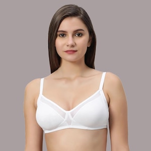 May include: White bra with adjustable straps and sheer mesh panels. The bra features a classic design with a comfortable fit. The bra is made of a soft, breathable fabric.