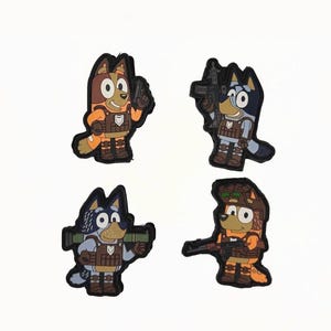 May include: Four cartoon dog character patches in various poses, each holding a weapon. The dogs are in shades of brown, blue, and orange, with black outlines. They are wearing tactical gear and have a military theme.