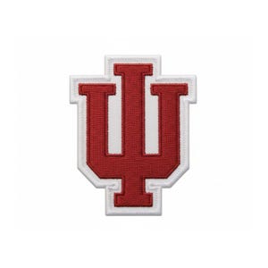 May include: Embroidered patch featuring the Indiana University logo, a stylized letter "I" with a vertical line through the center and two vertical lines on either side. The logo is in crimson red with a white border.