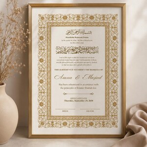 May include: A framed Islamic marriage certificate with gold ornate borders and black text. The document features Arabic calligraphy, English translations, the names Amna and Maziad, and the date Thursday, September 29, 2030, with signature lines for bride and groom.
