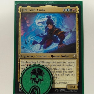 May include: A Magic: The Gathering card featuring "Fire Lord Azula" with a green and black game counter. The card has a blue and gold illustration of a character. The counter has a skull design and the number 3.