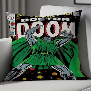 May include: Square cushion featuring a comic book cover with Doctor Doom. The design includes a green-clad figure with a metal mask and arms, set against a black background with the words "Doctor Doom" in large white letters.