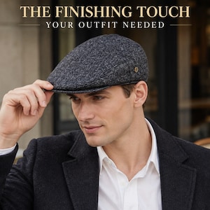 May include: A dark gray heathered flat cap with a small metallic side emblem. The text THE FINISHING TOUCH YOUR OUTFIT NEEDED is displayed at the top. The cap features a structured brim and a textured wool-like fabric in a classic newsboy style.