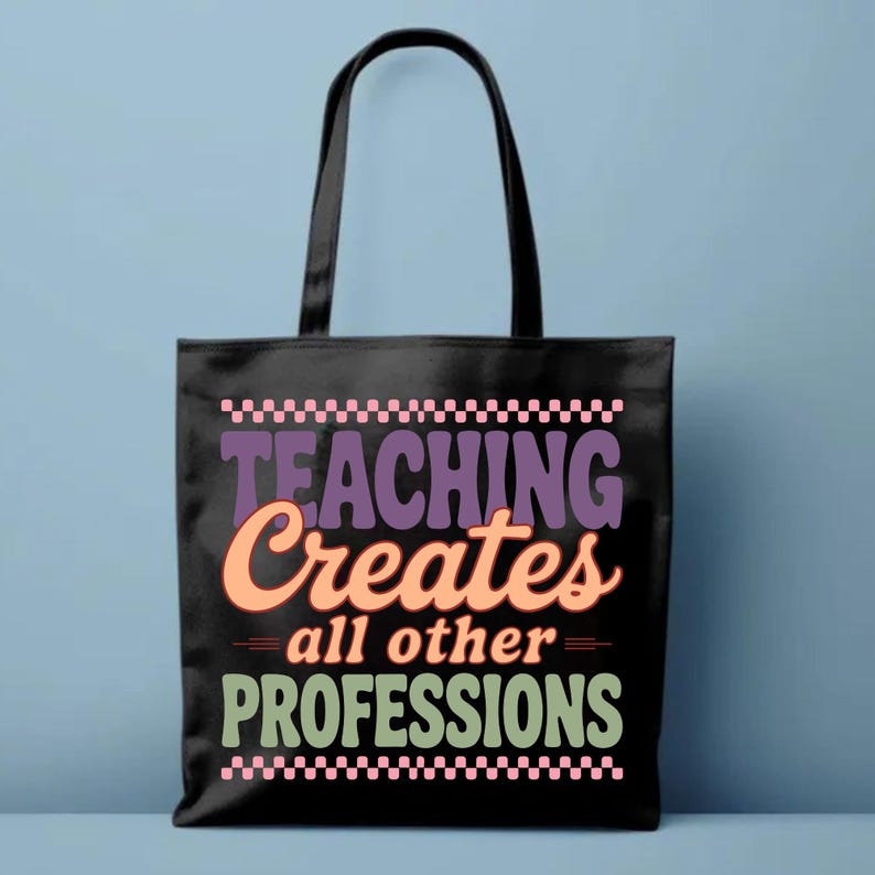 May include: Black tote bag with the text "TEACHING Creates all other PROFESSIONS" in purple, orange, and green. The bag has a checkered pattern at the top and bottom. The handles are black.