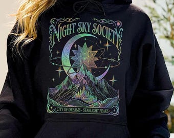 Maglietta Comfort Colors Night Sky Society, Maglietta City of Dreams Celestial, Felpa Starlight Peaks Fantasy, Felpa con cappuccio Mystical Moon & Star, Regalo