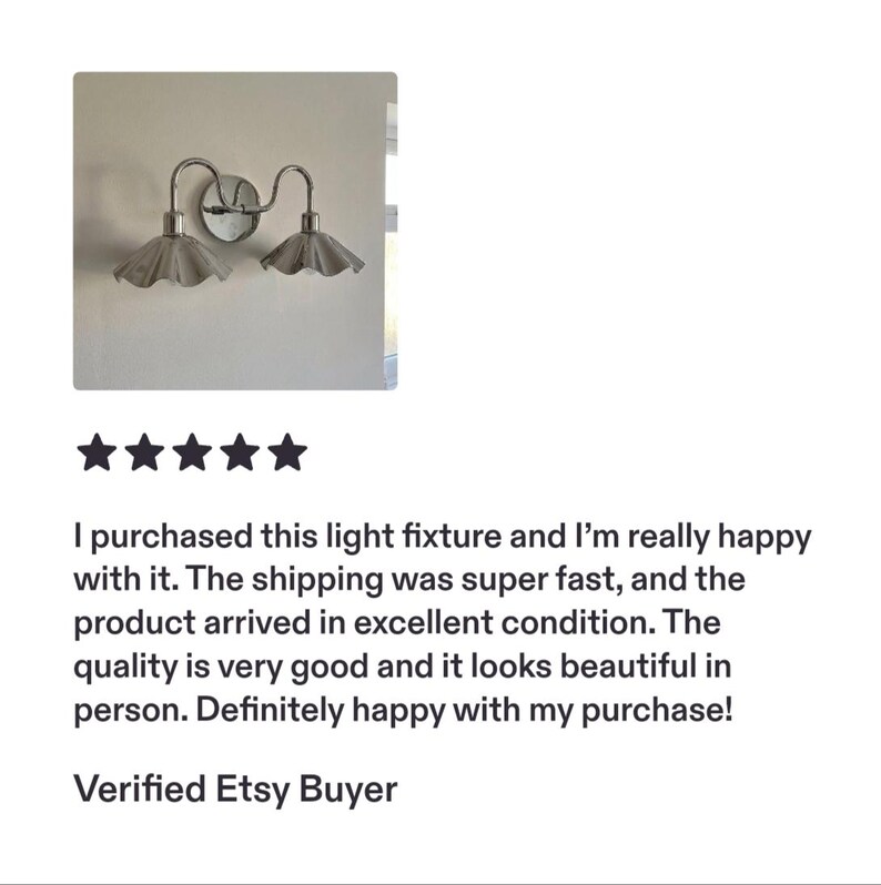 Small product photo of a double wall sconce with polished chrome curved arms and two fluted shades mounted on a plain neutral wall, shown above a five-star customer review.