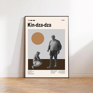 Könnte beinhalten: A framed poster with the film title "Kin-dza-dza" in black. The poster has a beige background with a brown circle and two figures in grayscale. The year "1986" is in the upper right corner.