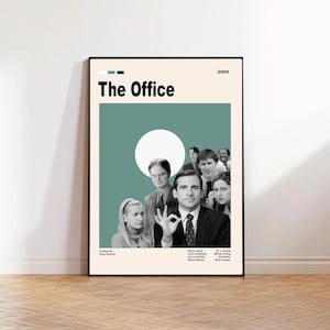 May include: A framed poster featuring the cast of the TV show "The Office." The poster has a cream-colored background with a teal green circle and the show's title in black. The cast is shown in black and white.