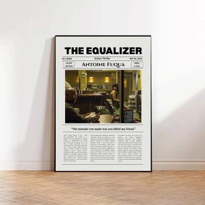 May include: A framed film poster for The Equalizer featuring a scene of a man sitting at a diner counter. The poster includes the title, director Antoine Fuqua, release date, runtime, IMDb rating, a quote, and descriptive text in a black and white layout.