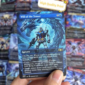 以下が含まれることがあります： 青と白のデザインのトレーディングカード。カードには「Will of the Temur」の文字と、ロボットのような姿とドラゴンのイラストが描かれています。カードには「High Quality Print」の文字も表示されています。