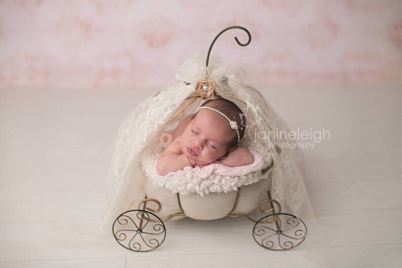 Dainty rhinestone headband for newborn photography, baptism, christening, or special occasion.  Small band of clear rhinestones with a silver finish and a simple silver pearl rhinestone embellishment.  Simply stunning baby headband.