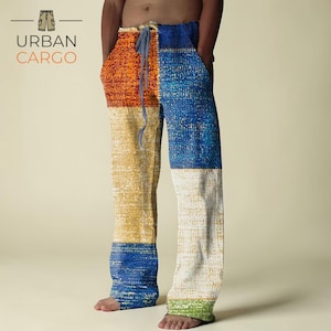 Peut inclure: Pantalon à motifs patchwork avec taille à cordon. Le design comprend des sections orange, jaune, bleu, blanc et vert. Le texte "URBAN CARGO" est visible dans le coin supérieur gauche.