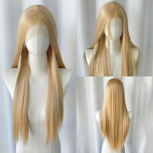 May include: A long, blonde wig with a lace front, displayed on a mannequin. The wig features straight, sleek strands and a natural-looking hairline. The color is a light, warm blonde, and the wig appears to be made of synthetic fibers.