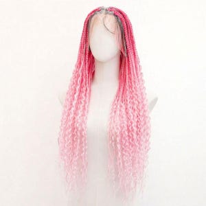 May include: A pink braided wig with a lace front is displayed on a mannequin. The wig features a gradient of pink hues, transitioning from a darker shade at the roots to a lighter, almost white colour at the ends. The braids are long and curly.