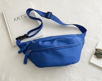 Riñonera de lona, bolso de pecho, cinturón, bolsa utilitaria, accesorio de viaje, riñonera deportiva para correr, bolso bandolera, diseño minimalista.