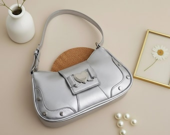 Bolso de hombro con lazo, accesorio de moda, bolso de mano elegante para el día a día, diseño chic, monedero femenino, estilo estructurado, bandolera de cuero moderna para mujer.