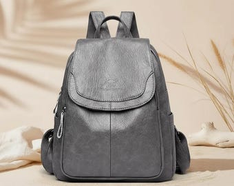 Mochila de cuero para portátil, bolso de trabajo, mochila de viaje, bolso esencial para la oficina, bolso de negocios, diseño elegante, estética moderna.